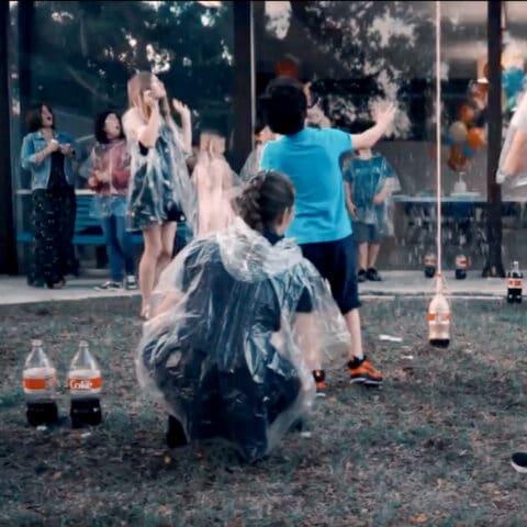 Kids And Moms Reacting To Gushing Geysers Activity At A Birthday Party